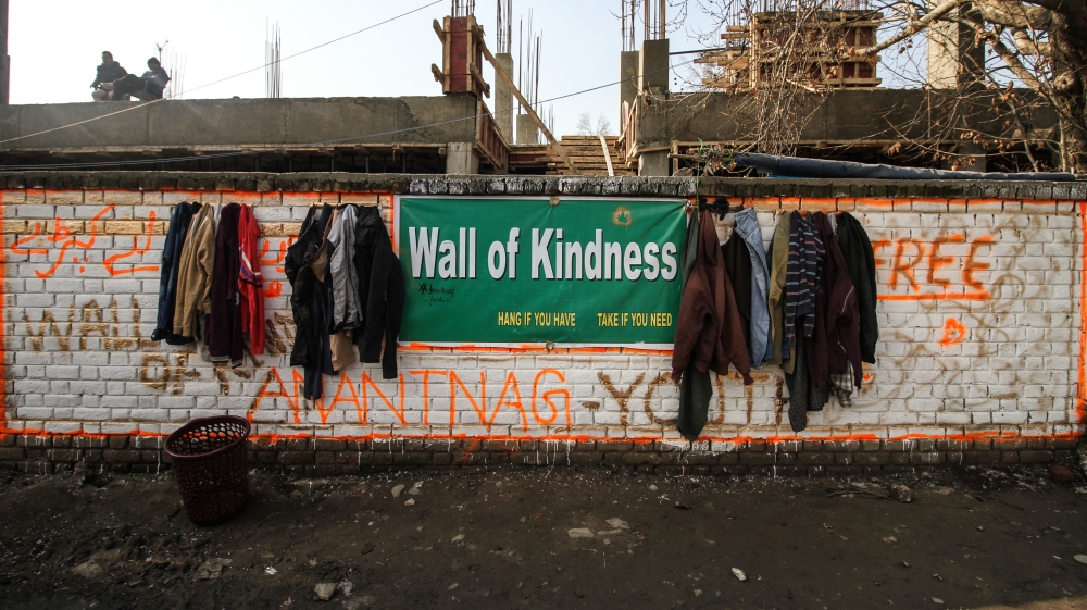 Inspired by the Srinagar’s Wall of Kindness, young boys established similar wall in Anantnag, South Kashmir [Sameer Mushtaq/Al Jazeera]