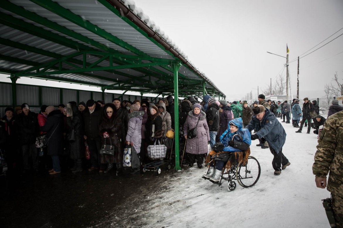 Every day thousands of people, many of them elderly, have to cross the checkpoint dividing government-controlled and non-government-controlled areas at Stanytsia Luhanska. The bridge is destroyed, mak