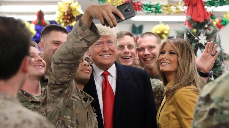 U.S. President Trump and the First Lady greet military personnel at the dining facility during an unannounced visit to Al Asad Air Base, Iraq