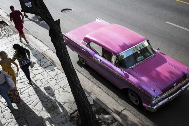 A collective taxi waits for customers in Havana, Cuba
