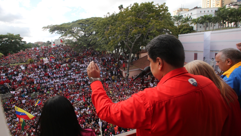 Maduro attends a rally in support of his government on Wednesday [Miraflores Palace handout via Reuters]