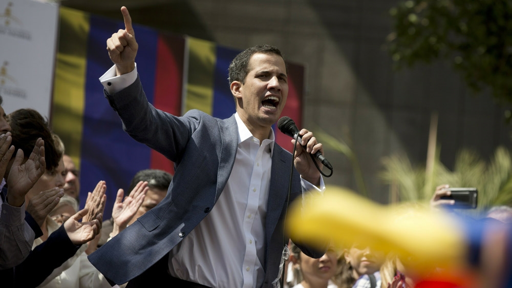 Juan Guaido, President of the Venezuelan National Assembly, delivers a speech during a public session with opposition members [File: Fernando Llano/AP]