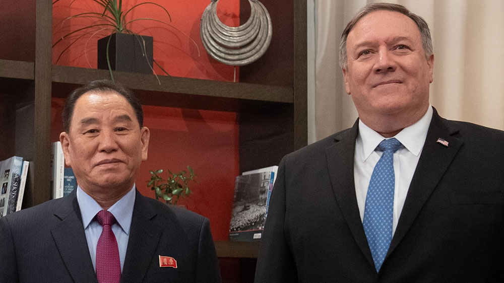 US Secretary of State Mike Pompeo, right, welcomes North Korean representative Kim Yong Chol prior to a meeting in Washington [Saul Loeb/AFP]