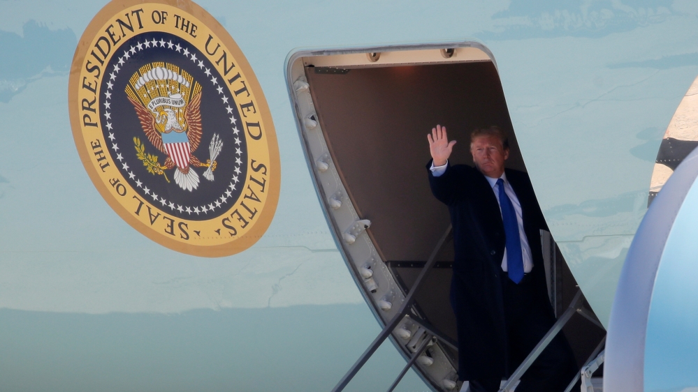 Trump boarding Air Force One as he departs for Vietnam [Jim Young/Reuters]