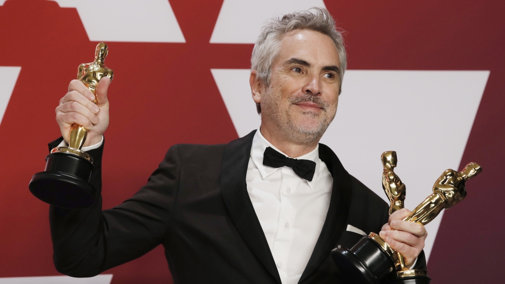 Alfonso Cuaron of Mexico won three awards for 'Roma' [Mike Segar/Reuters]