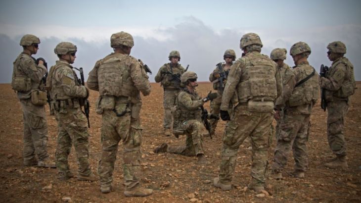 U.S. soldiers gather for a brief during a combined joint patrol rehearsal in Manbij, Syria.