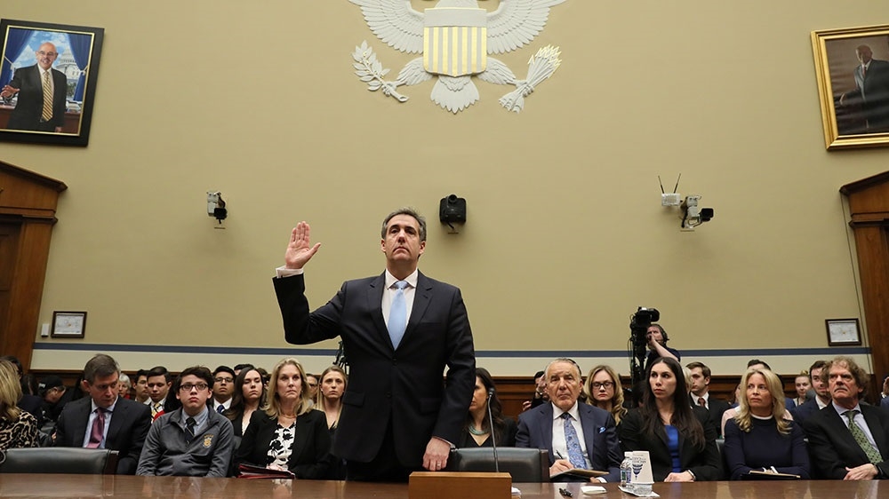 Michael Cohen is sworn in to testify at a hearing on Capitol Hill [Jonathan Ernst/Reuters] 