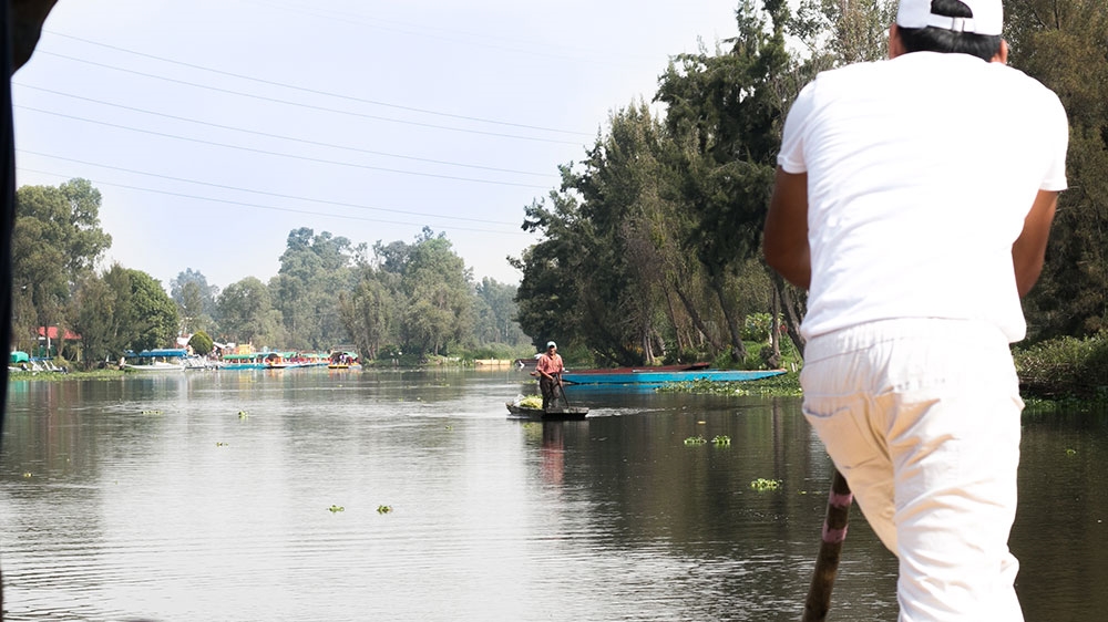 
The chinampas can only be reached by boat, and most of the wooden boats are motorless [Paul Biasco/Al Jazeera]
