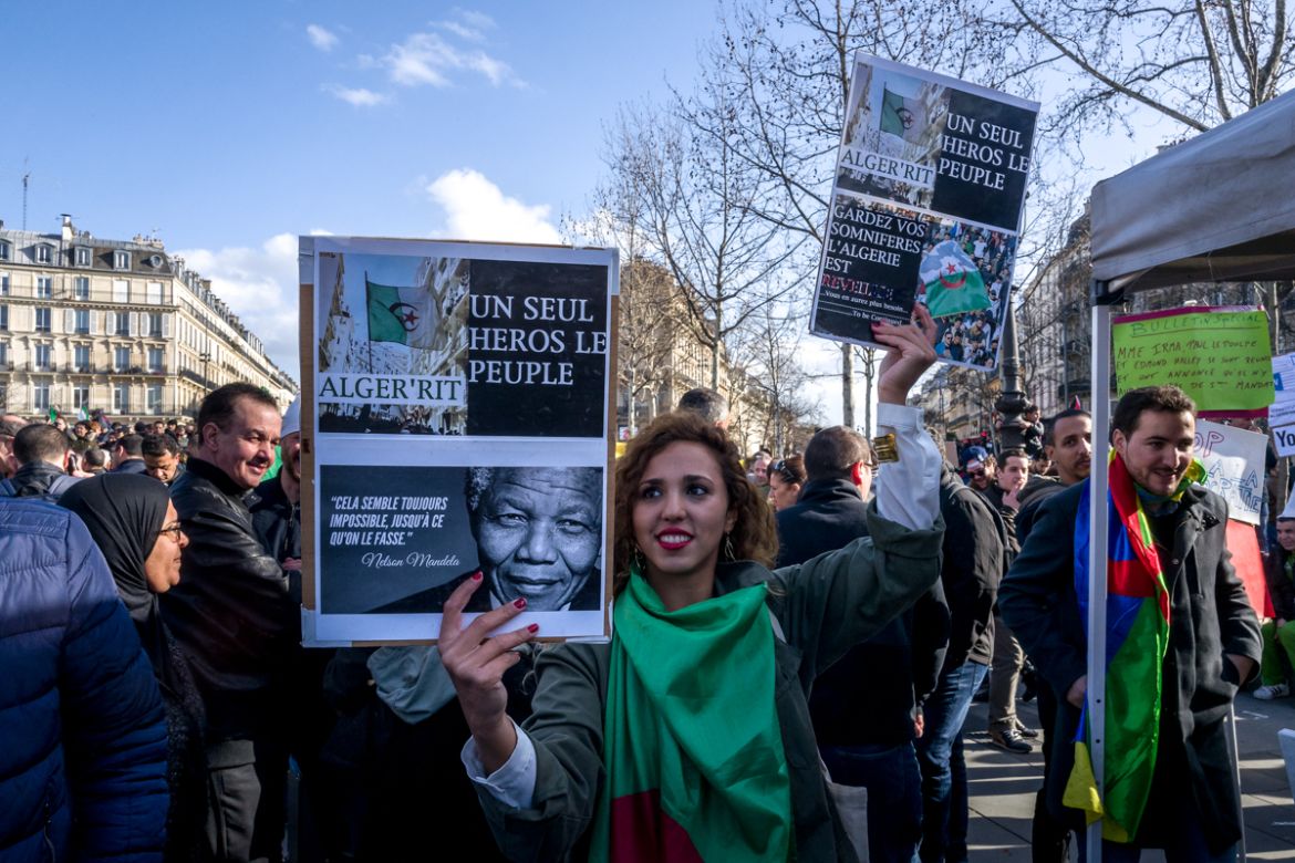 MARCH 10: An Algerian protester holds a sign against Algerian President Abdelaziz Bouteflika during a demonstration against the president seeking a fifth term in Place de la RE`publique in Paris, Fran