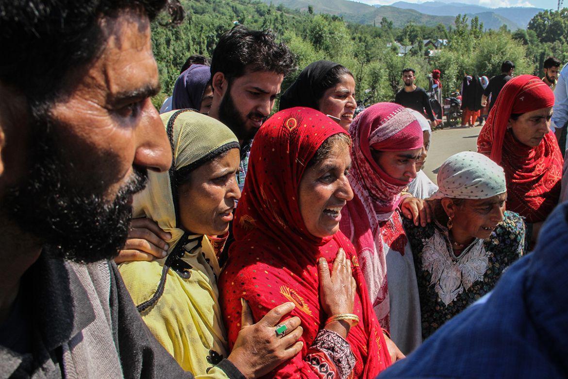 Women in Kokernag area of South Kashmir wailing while looking at the body of slain rebel after encounter took place in the area. [Sameer Mushtaq/Al Jazeera]