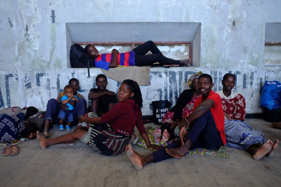 Otilia Sacur (blue-yellow head wrap) and her family are resting on the gym’s wooden floor. “I’m happy that at least some family members have been rescued,” Otilia says, “but most of them are still [in