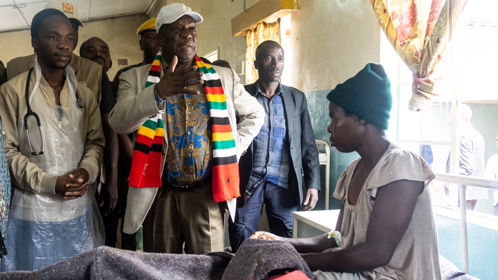 Mnangagwa visits a patient who was hit by rocks during Cyclone Idai [Tendai Marima/Al Jazeera]