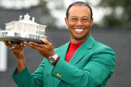 Golf - Masters - Augusta National Golf Club - Augusta, Georgia, U.S. - April 14, 2019. Tiger Woods of the U.S. celebrates with with his green jacket and trophy after winning the 2019 Masters. REUTERS/