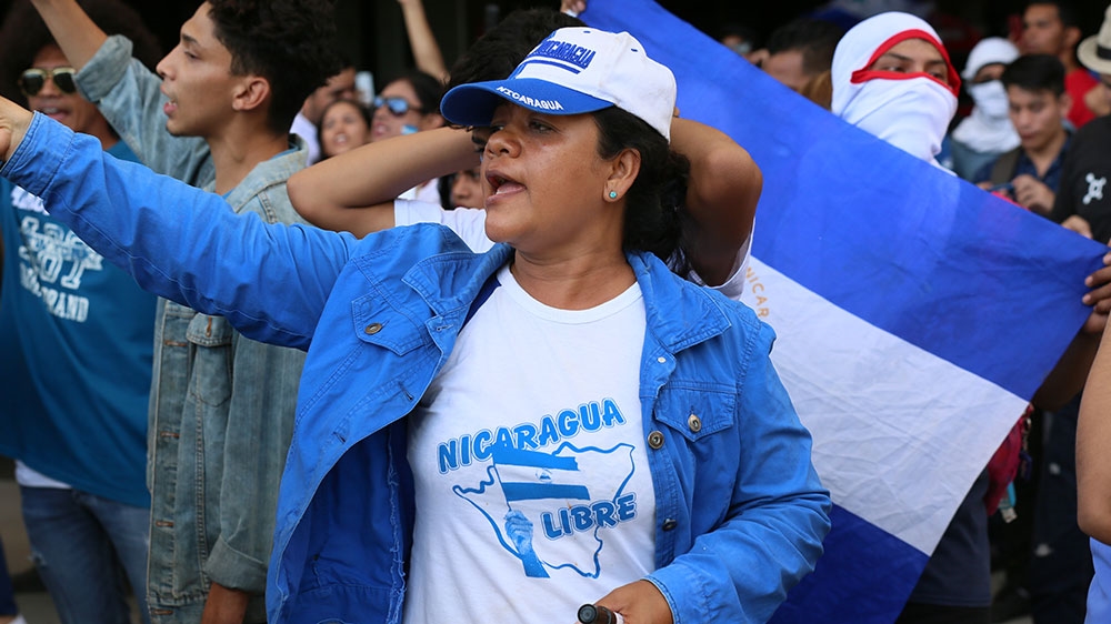 A Nicaraguan woman shouts anti-government slogans during a protest on March 16 in Managua. The government effectively banned such demonstrations last autumn [Chris Kenning/Al Jazeera]