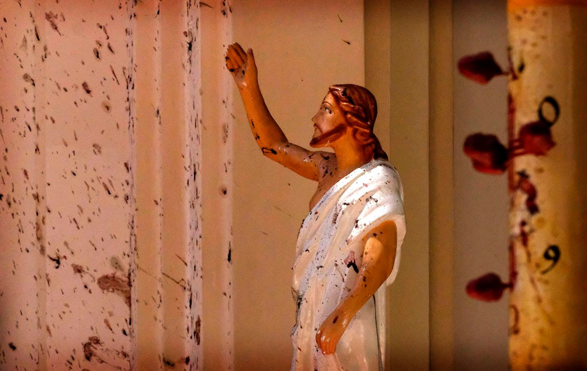 Blood stains are seen on the wall and on a Jesus Christ statue at the St. Sebastian''s Church after blast in Negombo, north of Colombo, Sri Lanka, Sunday, April 21, 2019. More than two hundred people w