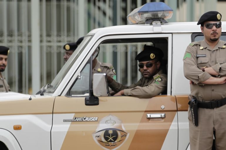 Saudi policemen form a check point near the site where a demonstration was expected to take place in Riyadh, Saudi Arabia, Friday, March 11, 2011
