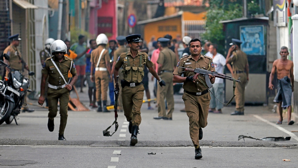 Sri Lankan police clear an area in Colombo, Sri Lanka [Dinuka Liyanawatte/Reuters]