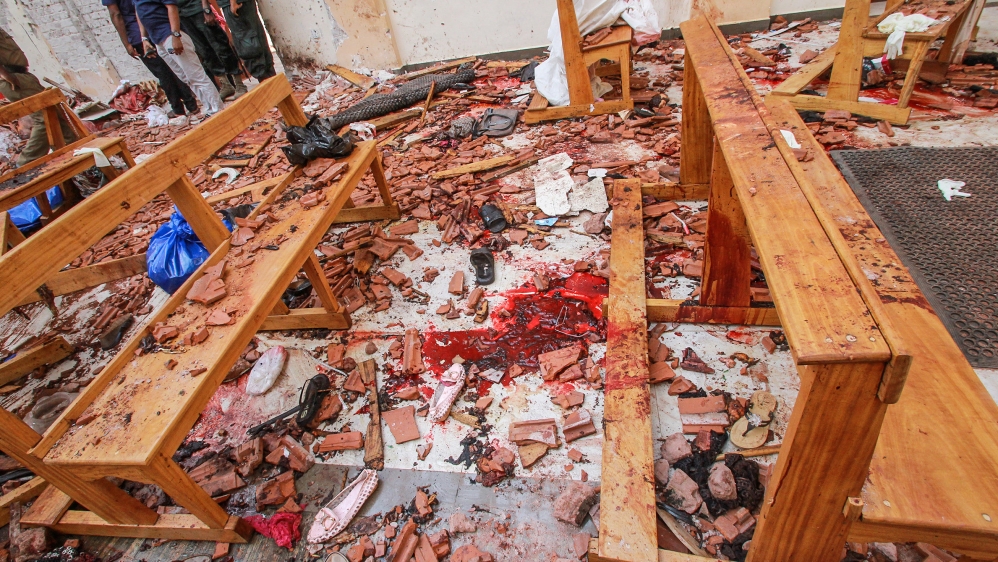 Blood stains are seen inside a church after a bomb blast in Negombo [Reuters]