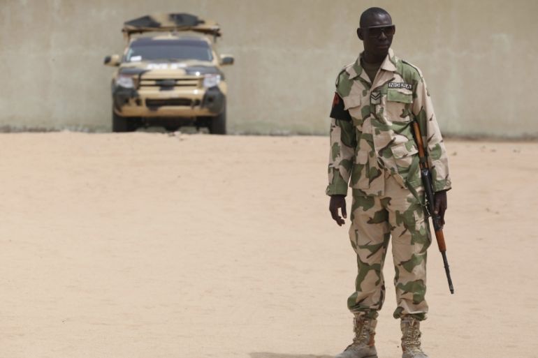 A soldier stands guard at a military base in Maiduguri, Nigeria