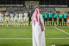 A member of the Kuwait Football Association (KFA) supervises a match of the Kuwait Premier League