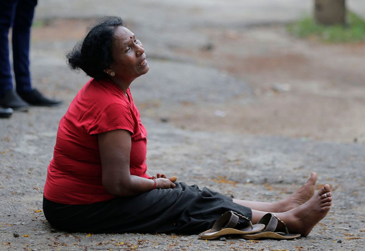 A relative of a blast victim grieves outside a morgue in Colombo, Sri Lanka, Sunday, April 21, 2019. More than hundred were killed and hundreds more hospitalized with injuries from eight blasts that r