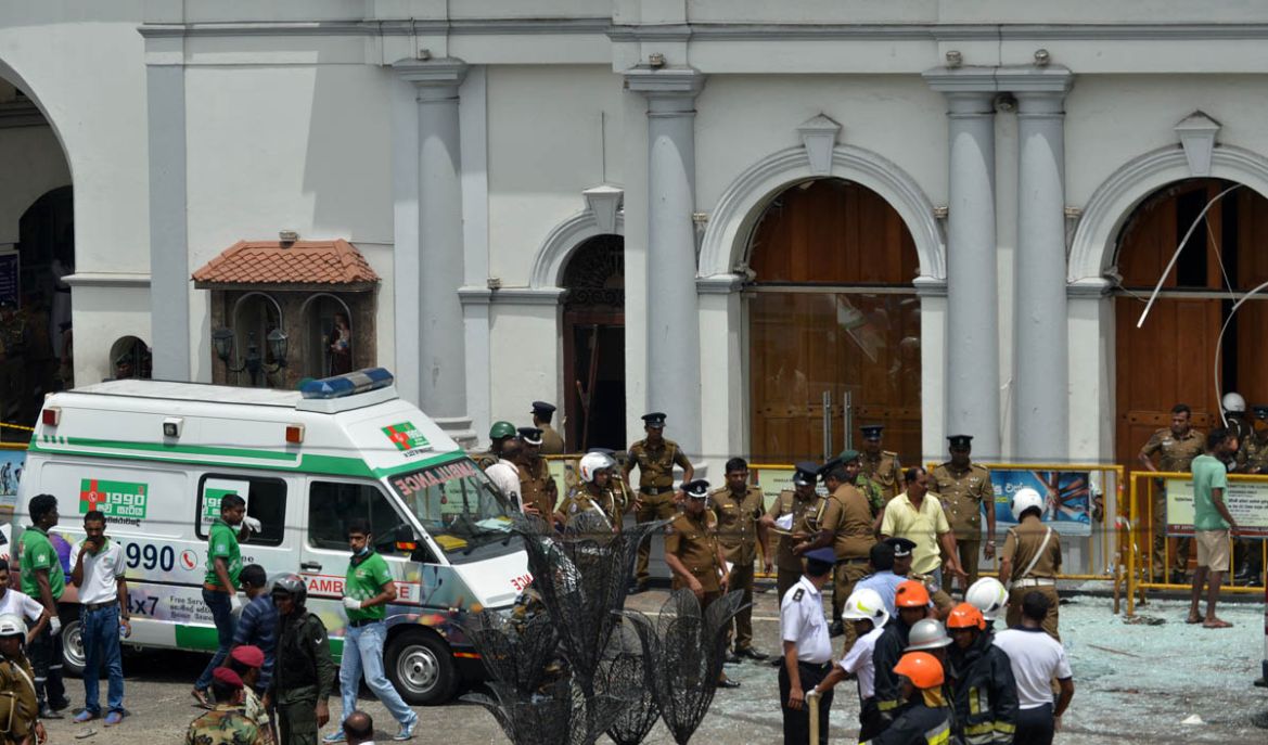 An ambulance is seen outside the church premises with gathered security personnel following a blast at the St. Anthony''s Shrine in Kochchikade, Colombo on April 21, 2019. At least 42 people were kille