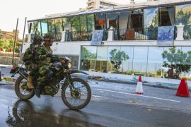 Sri Lankan Soldiers on a motorcycle drives past Kingsbury Hotel, which was attacked by a suicide bomber, in Colombo, Sri Lanka, Monday, April 22, 2019. A government crime investigator says the coordin