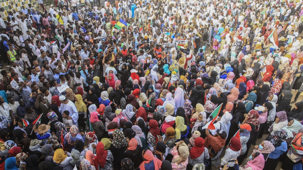 Tens of thousands converged in Khartoum, chanting 'power to civilians' [Ebrahim Hamid/ AFP]