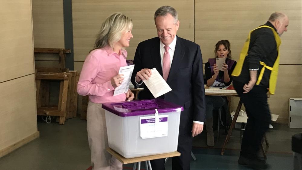 The opposition leader votes with his wife, Chloe Shorten, in Melbourne [Max Walden/Al Jazeera]