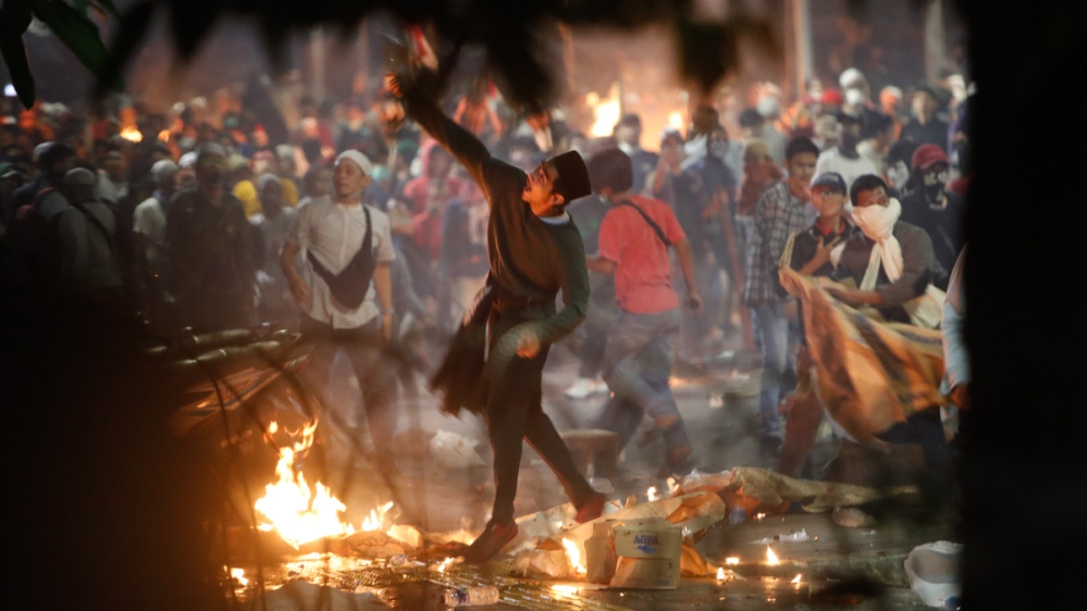 Indonesian protesters clash with the police during a protest outside of the Election Supervisory Board (Bawaslu) building, following the announcement of the presidential election in Jakarta, Indonesia