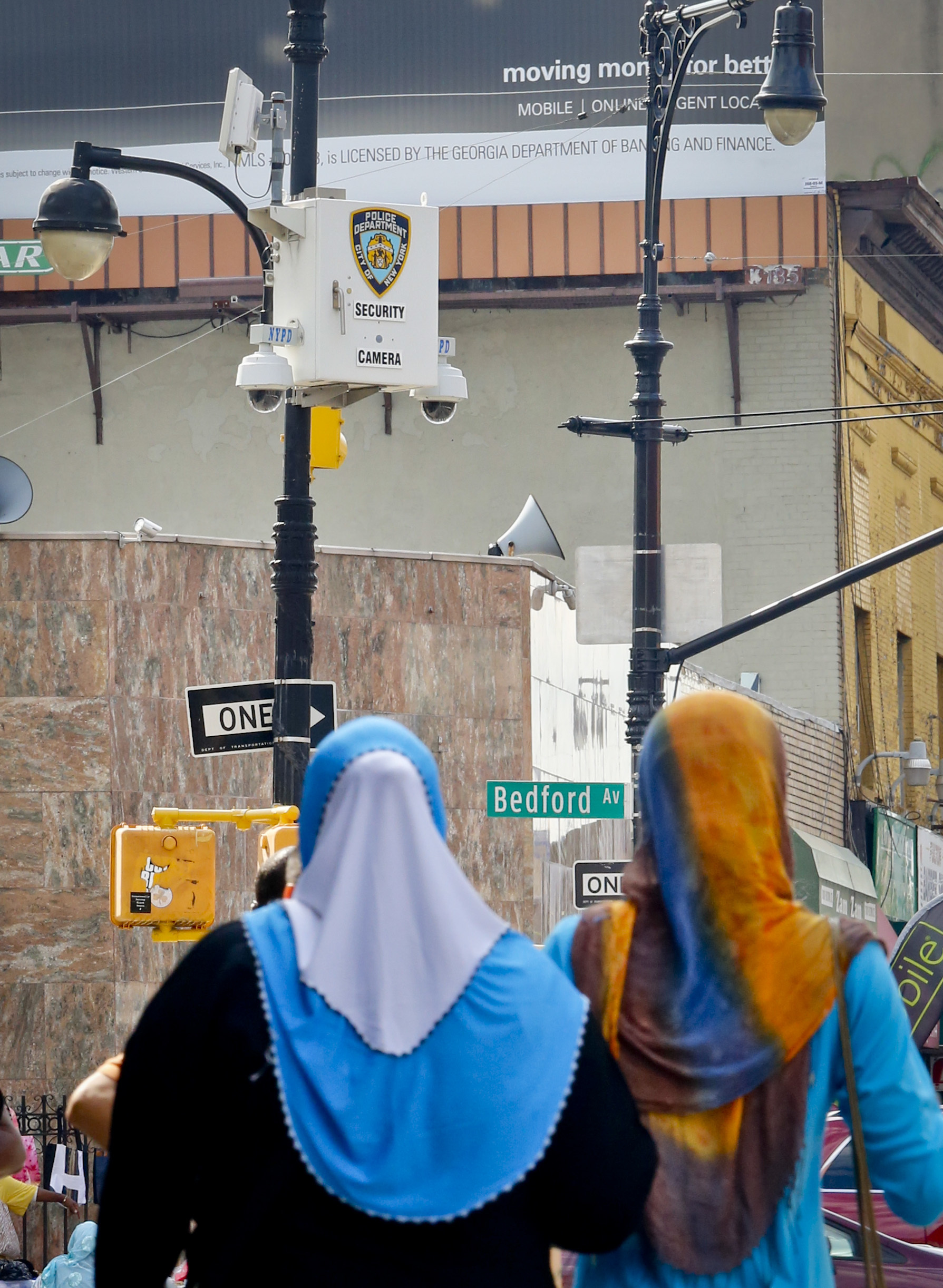 A police surveillance camera is placed on a light post overlooking the area of the Masjid At-Taqwa mosque at Bedford and Fulton Streets, Friday, August 19, 2016, in Brooklyn, New York [File: Bebeto Matthews/AP Photo]
