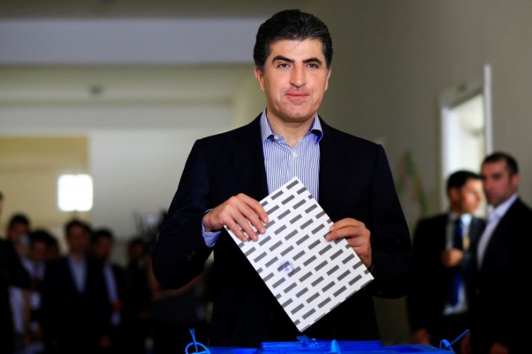 Kurdistan Regional Government Prime Minister Nechirvan Barzani casts his vote at a polling station during parliamentary elections in the semi-autonomous region in Erbil