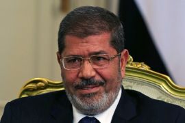 FILE PHOTO: Egypt''s President Mursi participates in a meeting with U.S. Defense Secretary Panetta at the presidential palace in Cairo