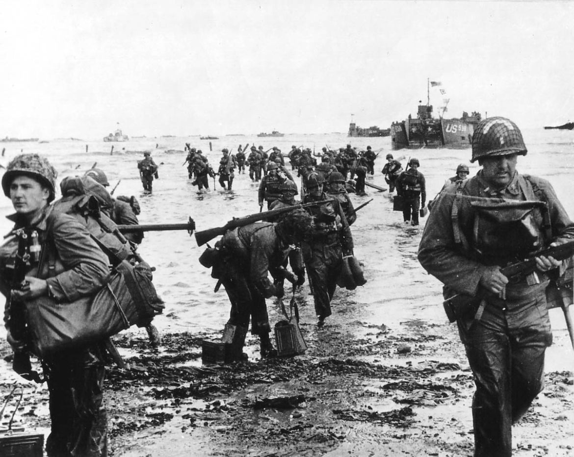 U.S. reinforcements land on Omaha beach during the Normandy D-Day landings near Vierville sur Mer, France, on June 6, 1944 in this handout photo provided by the US National Archives. On June 6, 1944,