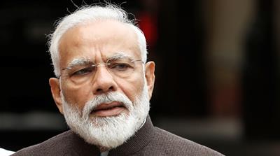 India's Prime Minister Narendra Modi speaks with the media on the opening day of the parliament session in New Delhi