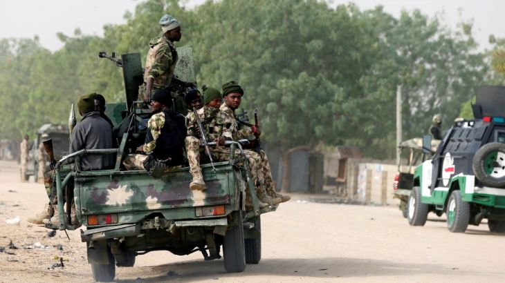 Nigerian military ride on their truck as they secure the area where a man was killed by suspected militants during an attack around Polo area of Maiduguri, Nigeria February 16, 2019. REURS/Afolabi Sot