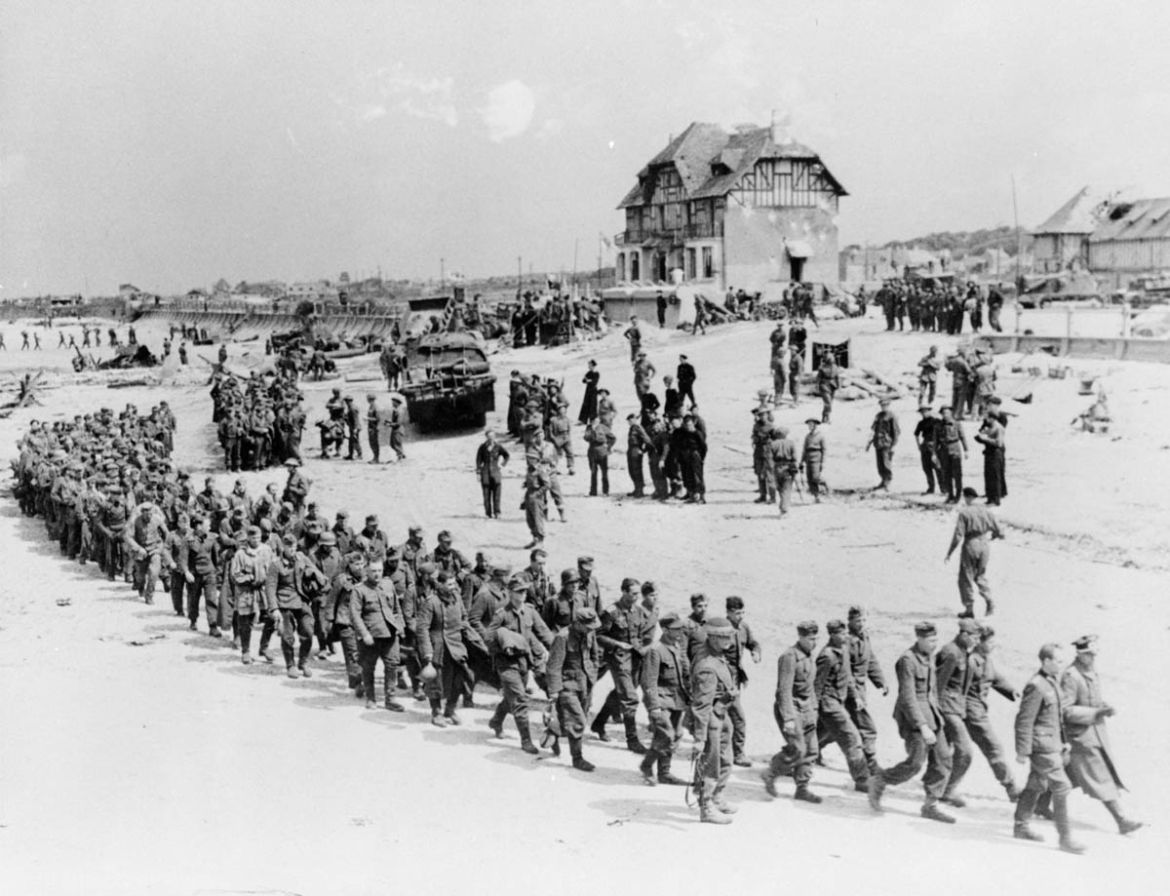 German prisoners-of-war march along Juno Beach landing area to a ship taking them to England, after they were captured by Canadian troops at Bernieres Sur Mer, France on June 6, 1944 in this handout p