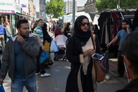 People from various ethnic backgrounds, particularly from the Muslim community around the market on Whitechapel High Street in East London, United Kingdom. This area in the Tower Hamlets is predominan