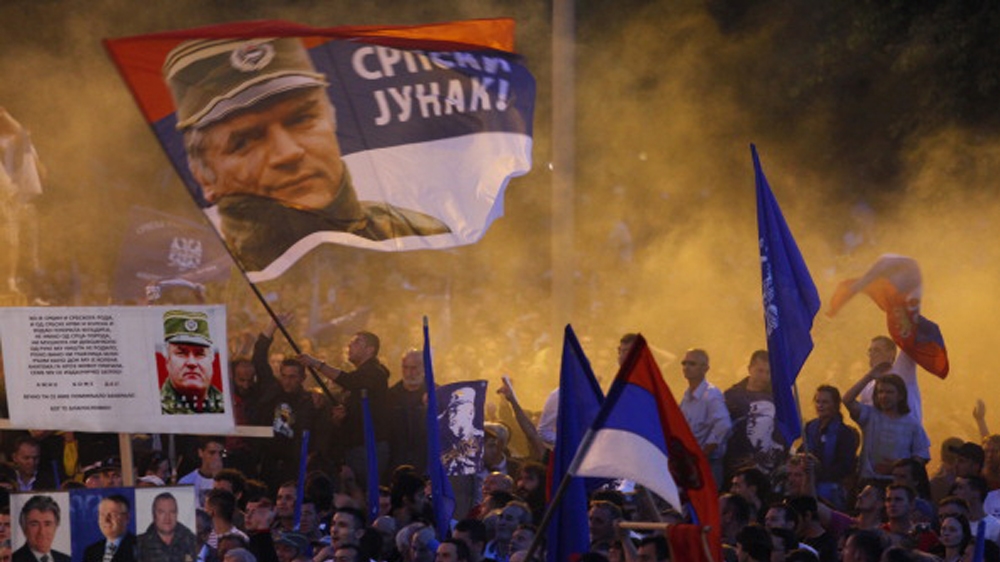 Pro-Mladic Supporters Demonstrate In Belgrade BELGRADE, SERBIA - MAY 29: Supporters of Ratko Mladic wave flags with his picture and reading in Serbian 'Serbian hero' during a rally organized