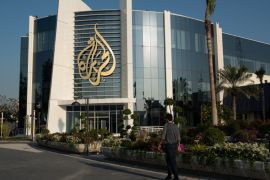Al Jazeera building / Al Jazeera Logo [Sorin Furcoi/Al Jazeera]