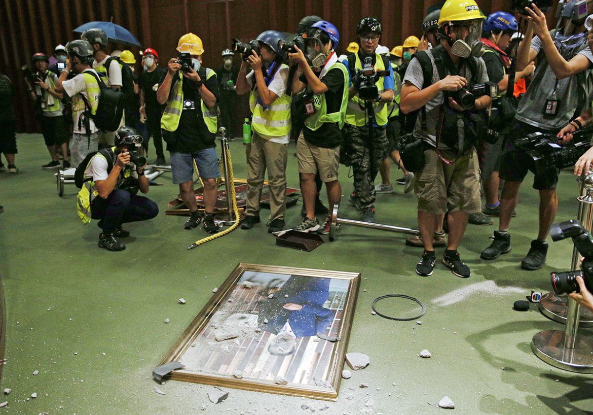 A defaced portrait of Andrew Leung, Chairman of the Legislative Council is seen on the floor after protesters break the Legislative Council building during the annual 01 July pro-democracy march Hong