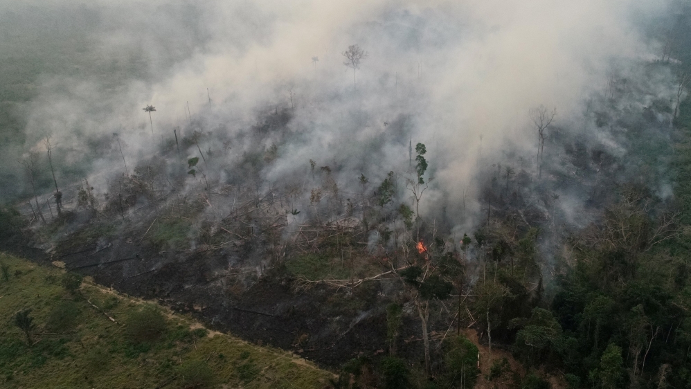 An aerial view of a tract of the Amazon jungle burning as it is being cleared by loggers and farmers in Porto Velho, Rondonia State, Brazil