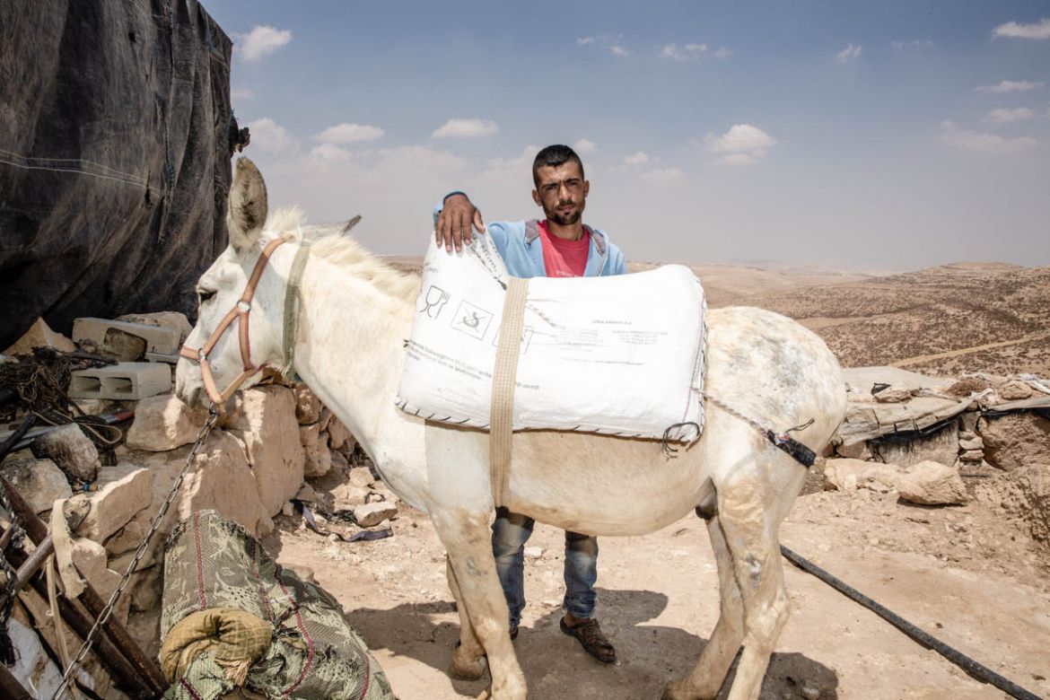 Saleh studies law at Hebron University. To get to classes he takes a one-hour donkey ride through the mountains to reach the closest town and then a bus from there. He spends an average of four hours