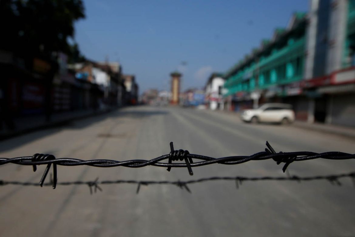 Barbed wire is seen laid on a deserted road during restrictions in Srinagar, August 5, 2019. REUTERS/Danish Ismail TPX IMAGES OF THE DAY