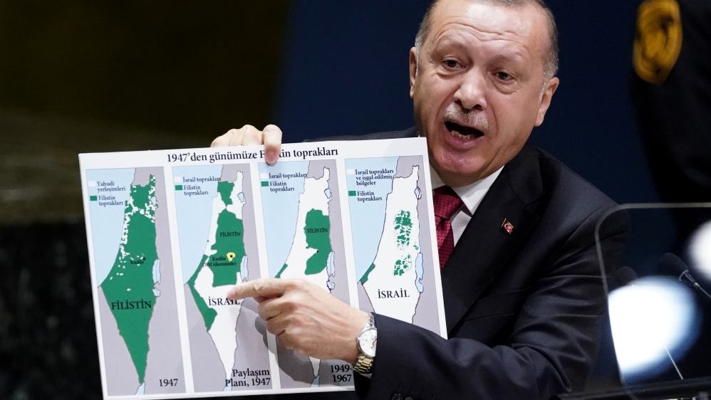 Turkey's President Recep Tayyip Erdogan holds up a map as he addresses the 74th session of the United Nations General Assembly at U.N. headquarters in New York City