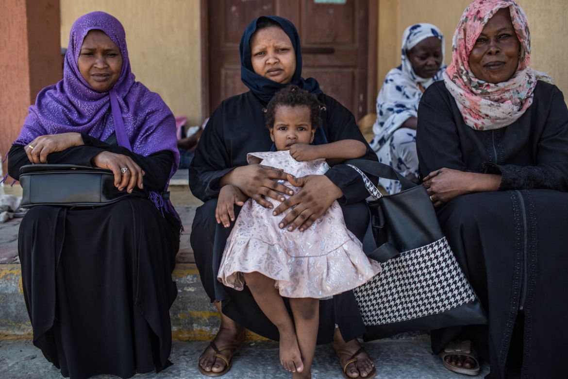 Hawaia Mohammed Yahia(center), 51 years old and widow, is a leader among the women and men on the improvised camp, where they have been stayin in dire conditions for the past month and displaced from