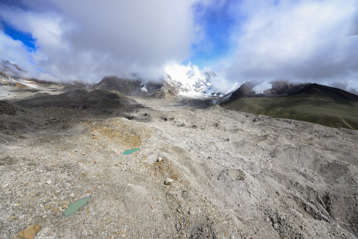 Rescue workers say the most visible change is a drop in elevation along the middle of the glacier and the growth of glacial ponds. Ice still lies below the dark blanket of rocky deposits, but the mora
