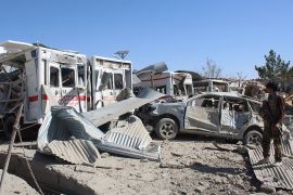 Afghan security forces investigate the site where a Taliban car bomb detonated near an intelligence services building in Qalat in Zabul province on September 19, 2019. - A car bomb attack targeting an