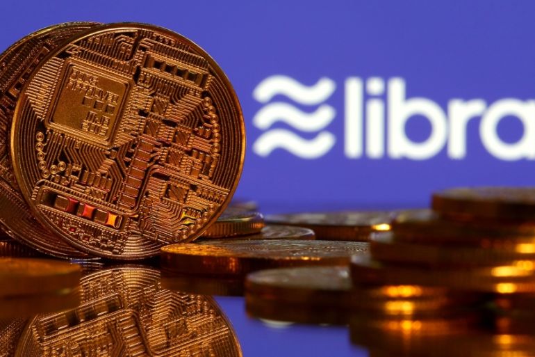 Representations of virtual currency are displayed in front of the Libra logo in this illustration picture, June 21, 2019