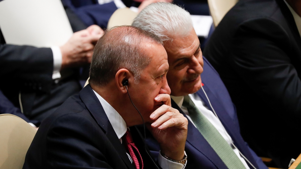 Turkey's President Recep Tayyip Erdogan alks with a member of his delegation during the 74th session of the United Nations General Assembly